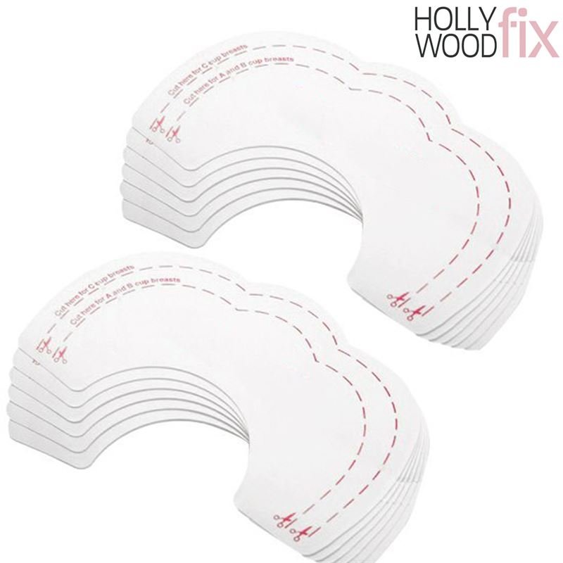 Ein Stapel Fashiongirl Breast Tape Hollywood Fix Instant Lift – 10 Stück, angeordnet in zwei Stapeln, zeigt halbmondförmige Streifen mit gestrichelten Linien und Scheren-Symbolen, die anzeigen, wo geschnitten werden muss.