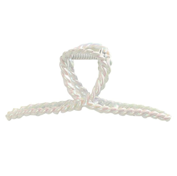 Die SOHO Caprina Hair Claw – White von SOHO zeichnet sich durch ein schillerndes, gedrehtes Kunststoffdesign mit einer Schleife und einer sichtbaren Metallfeder aus, die an ein Einhornhorn erinnert und vor einem weißen Hintergrund glänzt.