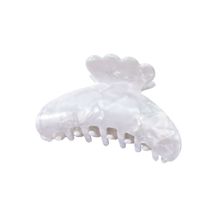 The SOHO Joy Hair Claw - Pure White by SOHO features a pearly white marbled finish, medium size, scalloped edges, and interlocking teeth for secure hold.