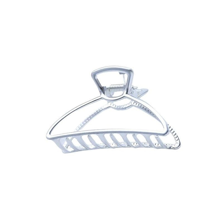 The SOHO Tori Small Metal Hair Claw in matt silver features a triangular design with open slats, perfect for securing a messy bun. This stylish SOHO hair clip is an essential addition to your accessory collection.