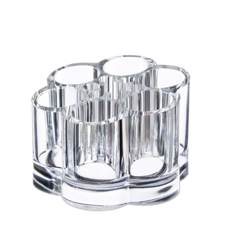 Der UNIQ Flower Makeup Acrylic Organiser – U301 von UNIQ verfügt über sieben Wabenfächer, die sich ideal für die Aufbewahrung von Make-up, Stiften, Pinseln und Beauty-Tools eignen, und hat ein klares zylindrisches Design.